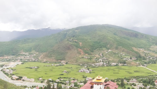 Scenic view of landscape and mountains against sky