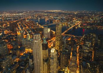 Aerial view of illuminated city at night