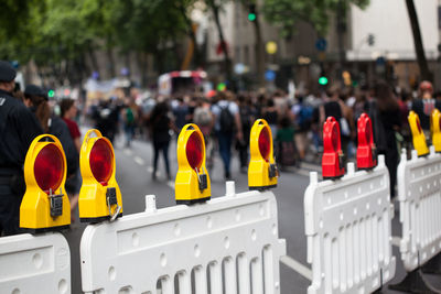 Close-up of road reflectors on street in city