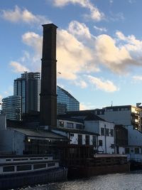 Low angle view of factory against sky