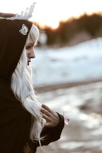 Side view of young woman in water