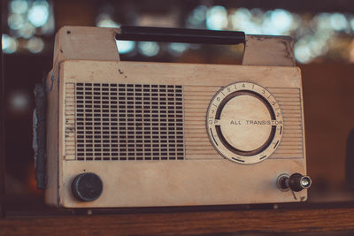Close-up of vintage radio on table