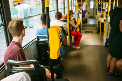 Young man traveling in bus