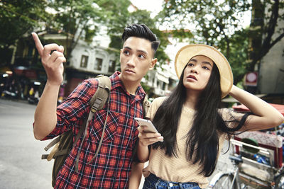 Portrait of young woman using mobile phone