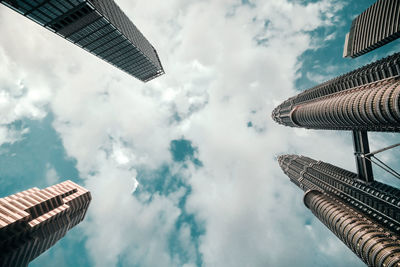 Directly below shot of buildings against sky