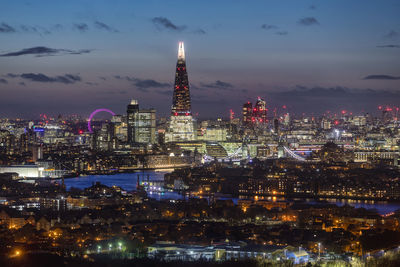 Illuminated buildings in city at night