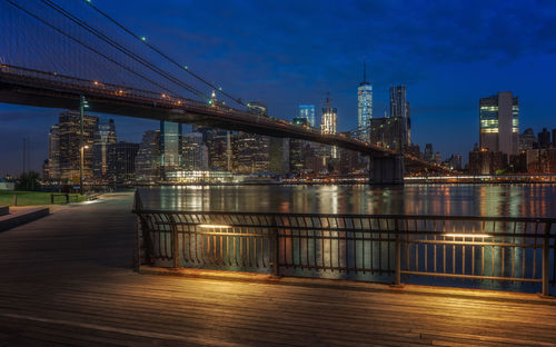 Suspension bridge over river at night