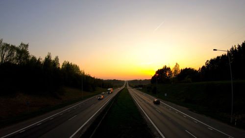 Diminishing perspective of road against sky during sunset