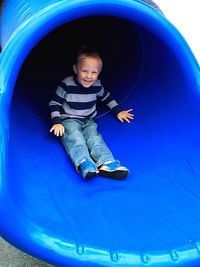 Full length of boy playing on bed