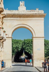 People in front of historical building