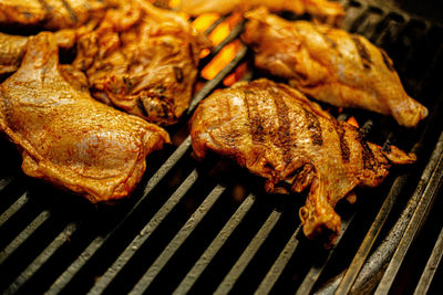 High angle view of meat on barbecue grill