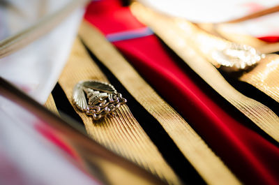 Close-up of textile and jewelry on table