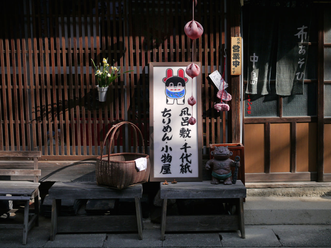 architecture, built structure, building exterior, door, hanging, indoors, house, chair, potted plant, wall - building feature, wood - material, decoration, absence, entrance, flower, no people, day, table, lantern, old-fashioned