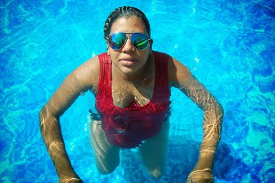 Portrait of young woman in swimming pool