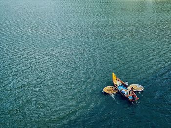 Aerial view of people in boat on sea