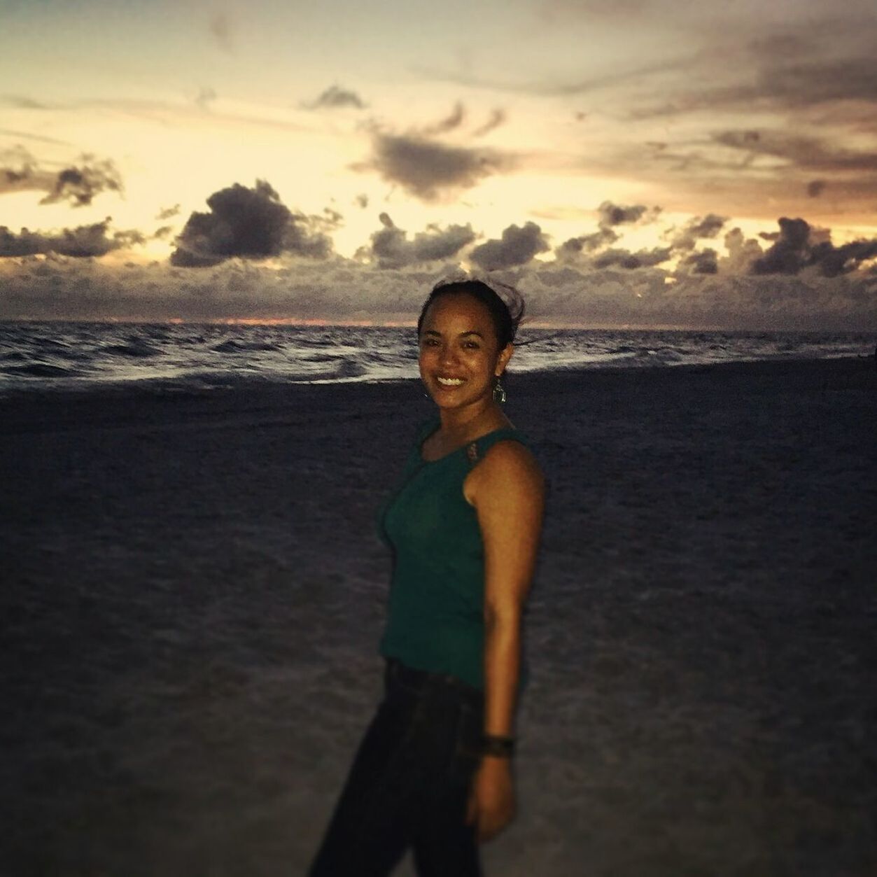 sea, beach, person, portrait, looking at camera, sky, water, horizon over water, young adult, lifestyles, shore, leisure activity, young women, front view, standing, happiness, smiling, casual clothing