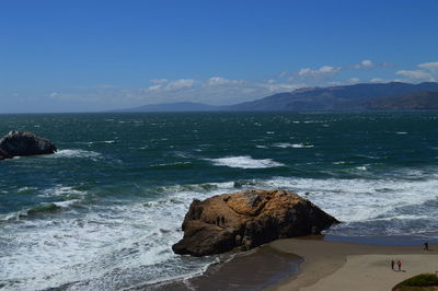 Scenic view of sea against blue sky