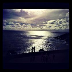 Scenic view of sea against cloudy sky