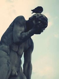 Low angle view of statue against sky