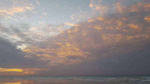 Scenic view of sea against sky at sunset