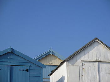 Low angle view of building against clear blue sky