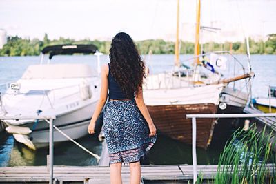 Rear view of woman standing in park