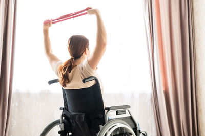 Disabled woman exercising at home