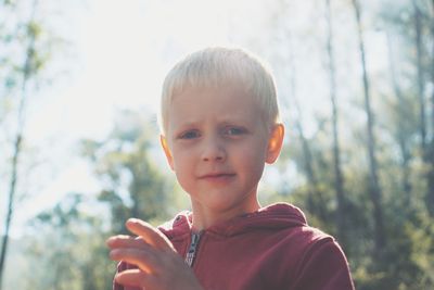 Close-up portrait of boy in forest