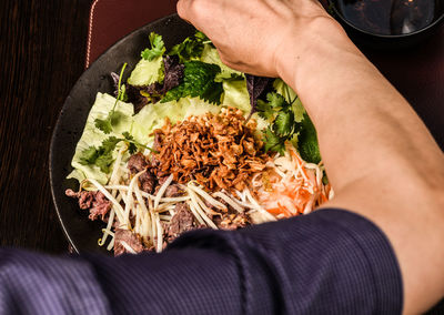 Midsection of woman holding food