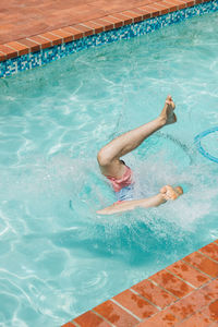 High angle view of man swimming in pool