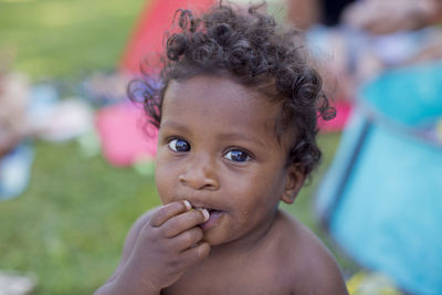 Toddler boy looking at camera