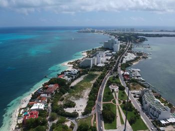 High angle view of sea and buildings against sky