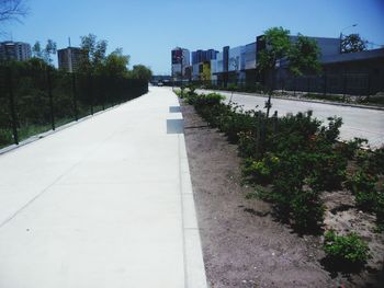 Street amidst buildings against sky