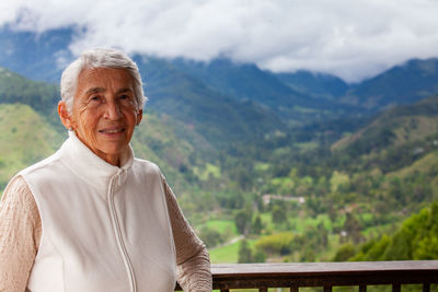 Senior woman at the beautiful view point over the cocora valley in salento in colombia