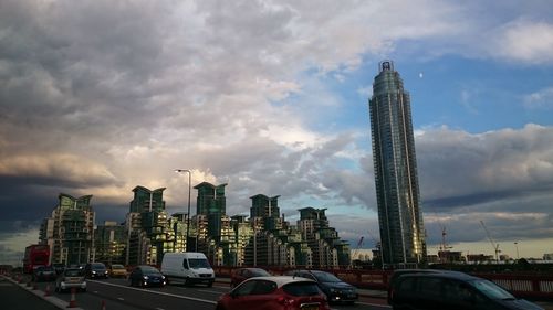 City skyline against cloudy sky