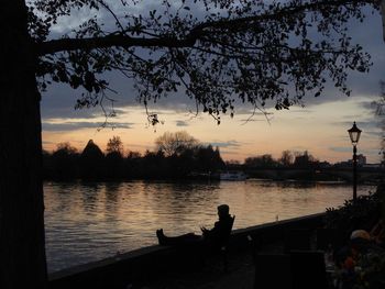 Scenic view of lake at sunset