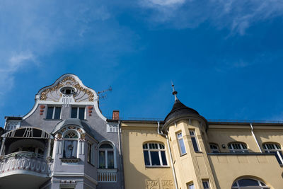 Low angle view of building against blue sky