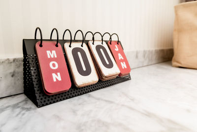 Close-up of text on wooden table
