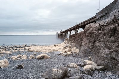 Bridge over sea against sky