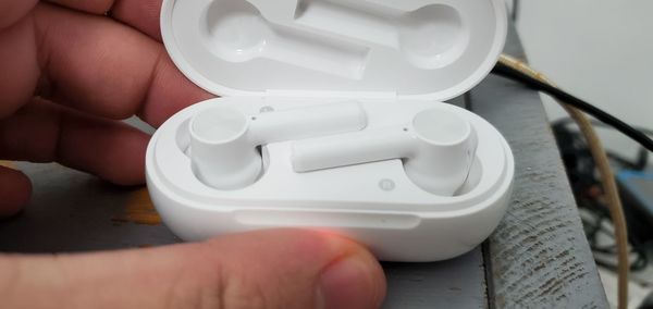 Cropped hand of person holding thermometer