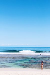 Scenic view of sea against clear blue sky