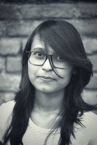 Close-up portrait of smiling young woman