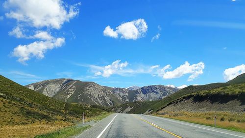 Panoramic view of road amidst mountains against sky