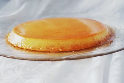 Close-up of fresh coconut flan served in plate