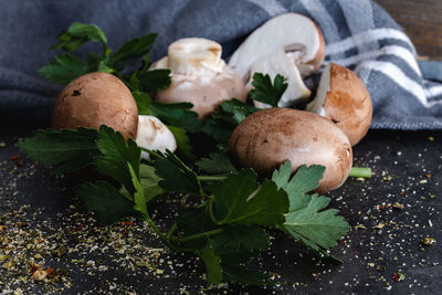 Close-up of mushrooms and herbs on table