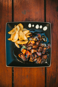 High angle view of meat on barbecue grill