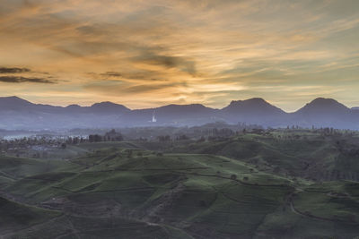 Scenic view of landscape against sky during sunset