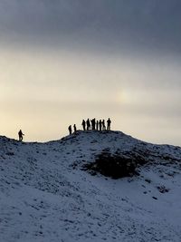 Group of people on snow covered land