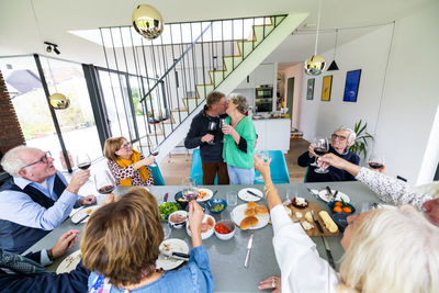 High angle view of mother and daughter sitting at home