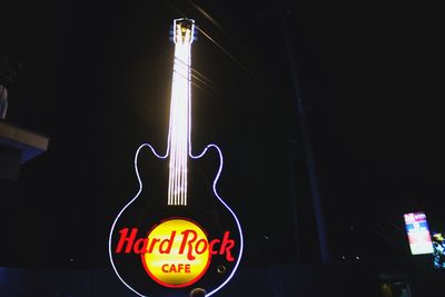 Information sign in city at night